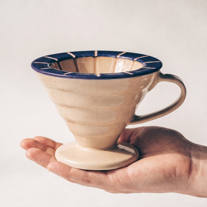 Concept sample: the dripper resting on an open hand to show its size